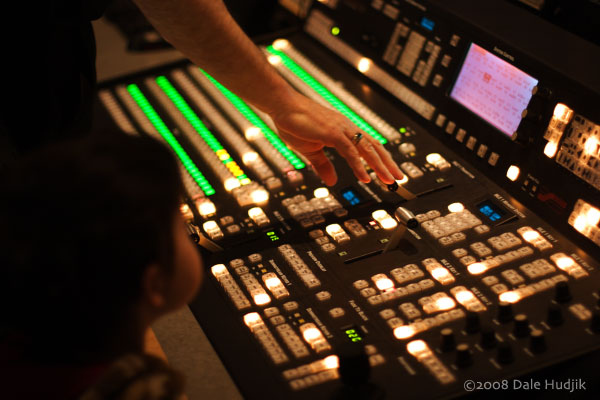 little boy observing a TV control room